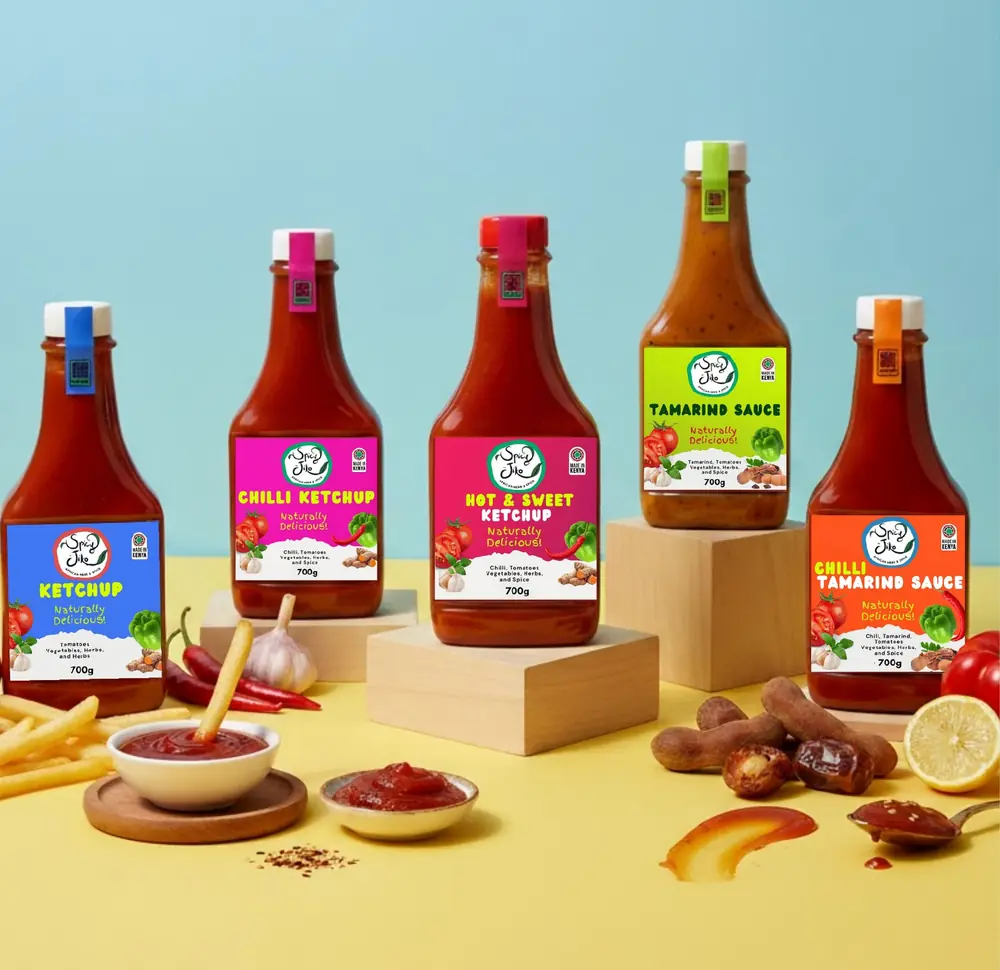 Spicy Jiko ketchup and tamarind sauce bottles with chips and tamarind pods